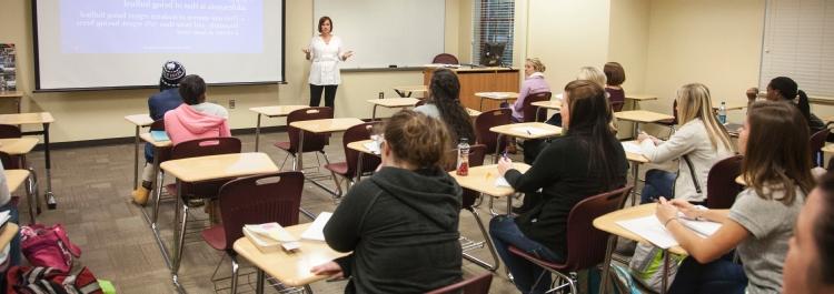 Psychology faculty member teaches class